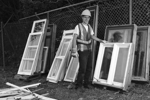 Construction site with builders removing waste in Osterley
